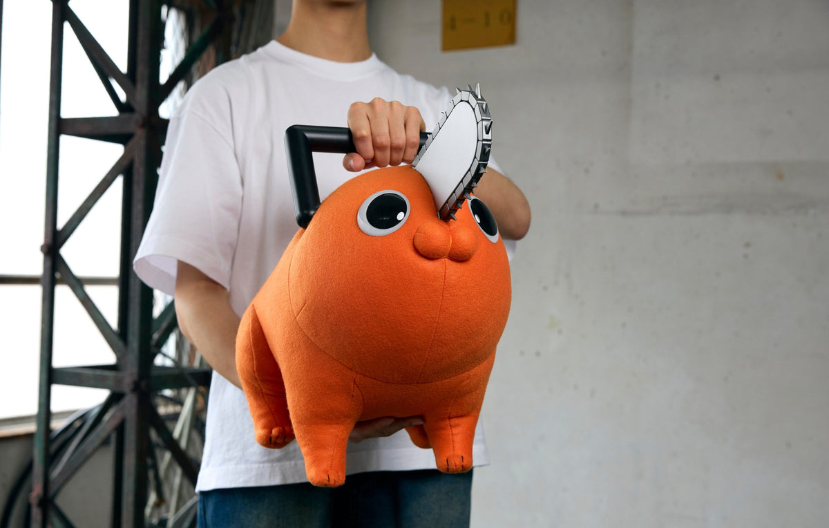Person holding the Chainsaw Man Life Size Doll Pochita Plush to show its size